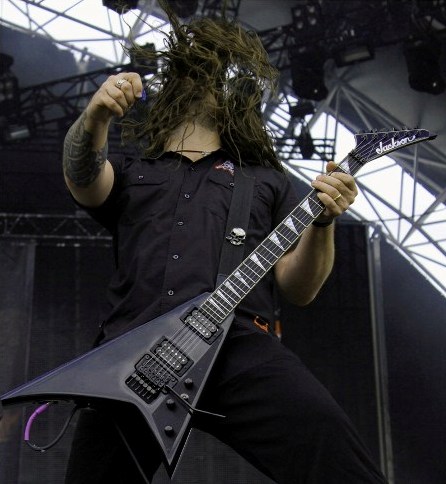 Andreas kisser from Sepultura headbanging and playing guitars with Anthrax