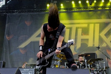 Frank Bello headbanging on stage with Anthrax