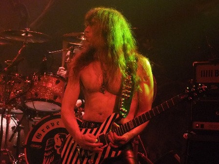 Axel Ritt playing guitar with Grave Digger in Paris