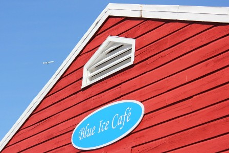 An airplane flying over the Blue Ice café in Greenland