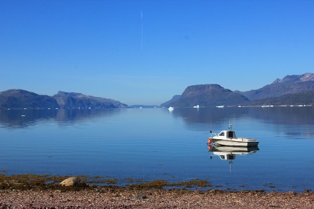 The majestic Tunulliarfik Fjord with a lonely boat, Greenland