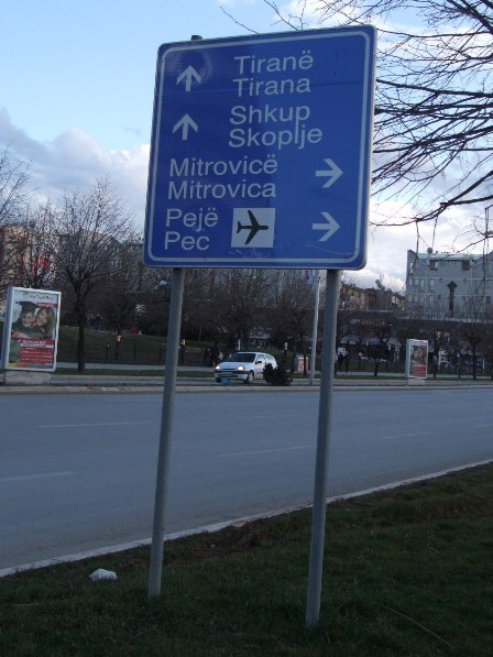 Road signs to Tirana, Skopje, Mitrovica and Peć 