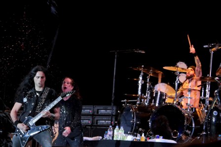 Gus Ozzy and Tommy under the rain at the Hellfest