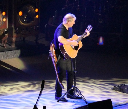 Alex Lifeson playing acoustic guitar