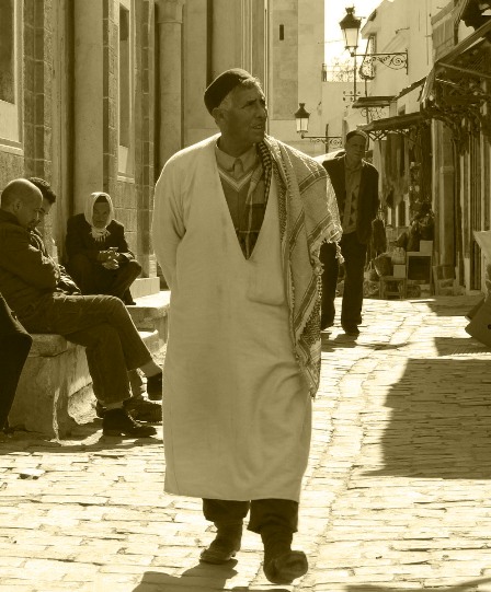 A man walking the streets in the Medina in Tunis