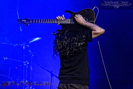 Pablo García playing guitar on his back - live with Warcry