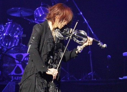 Sugizo playing violin with X Japan